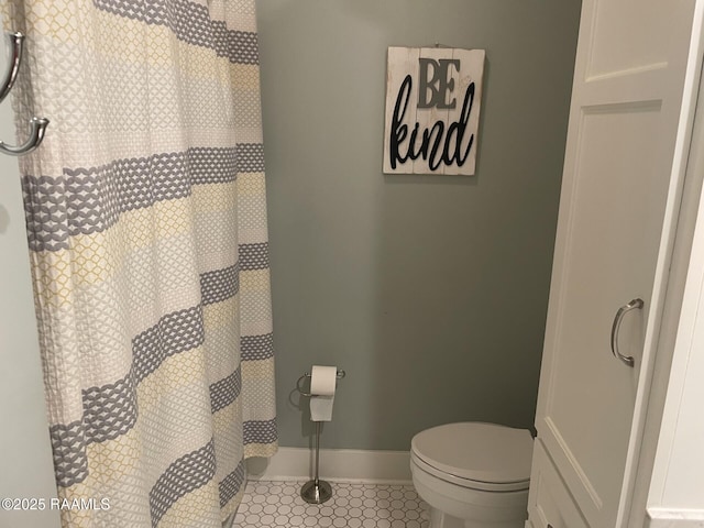 3713 Vidrine Rd, Ville Platte, LA 70586 - bathroom with tile patterned floors, toilet, baseboards, and a shower with curtain