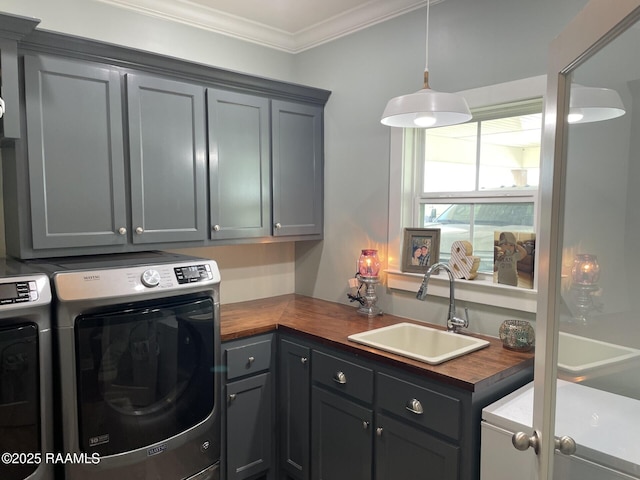 3713 Vidrine Rd, Ville Platte, LA 70586 - washroom with cabinet space, washing machine and dryer, and ornamental molding