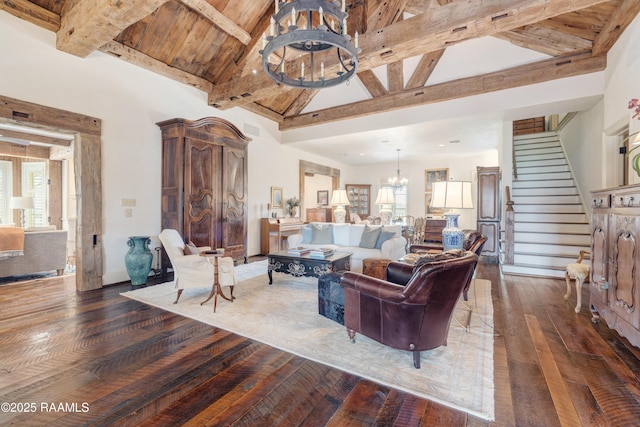 living room featuring beamed ceiling, stairway, a notable chandelier, high vaulted ceiling, and wood-type flooring