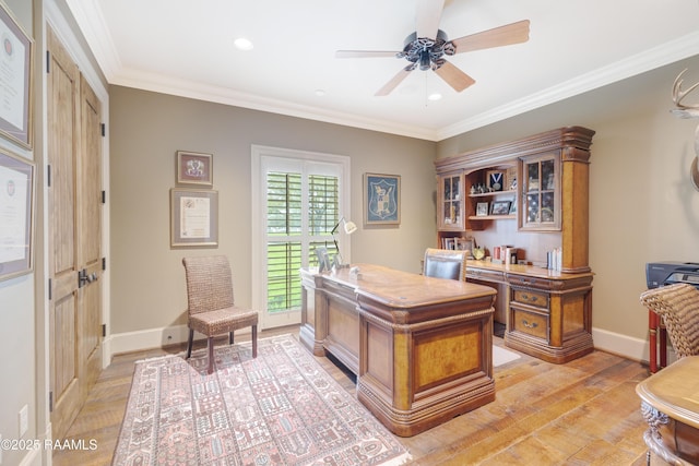 home office with light wood finished floors, crown molding, baseboards, recessed lighting, and a ceiling fan