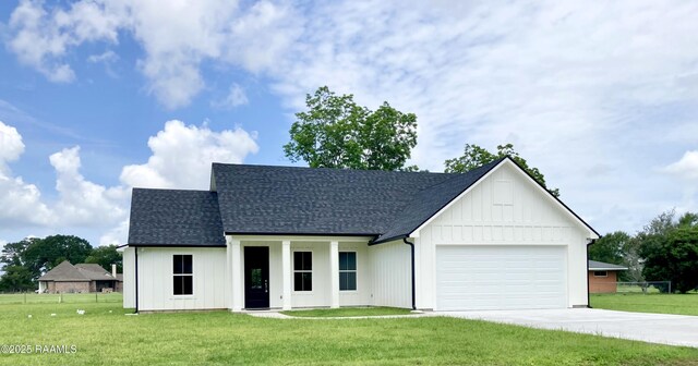 127 Guard Rd, Scott, LA 70583 - modern farmhouse style home with concrete driveway, board and batten siding, a garage, and roof with shingles