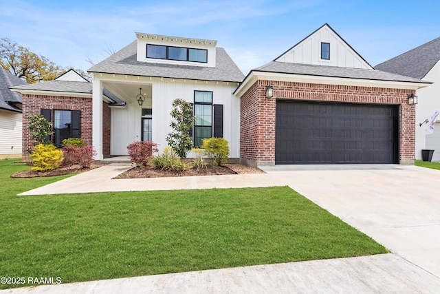 modern inspired farmhouse with brick siding, a front yard, board and batten siding, and concrete driveway
