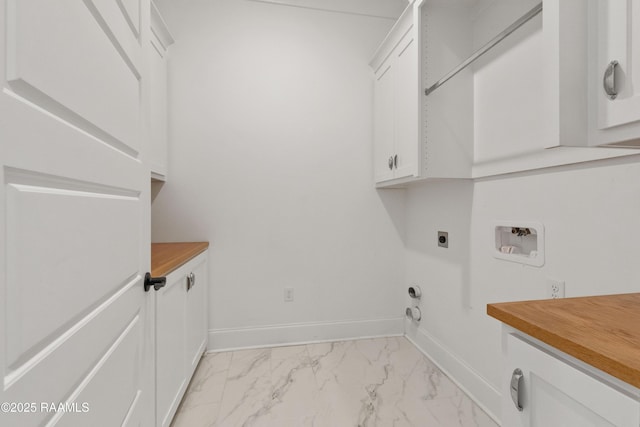 303 Canary Palm Way, Youngsville, LA 70592 - laundry room with hookup for an electric dryer, cabinet space, hookup for a washing machine, light marble finish flooring, and hookup for a gas dryer