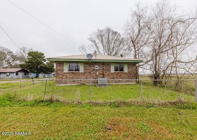1010 Dugas Ln, Saint Martinville, LA 70582 - back of house featuring brick siding and central AC unit