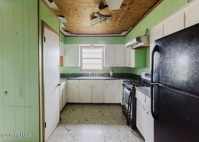 1010 Dugas Ln, Saint Martinville, LA 70582 - kitchen with freestanding refrigerator, under cabinet range hood, gas range oven, a sink, and light floors