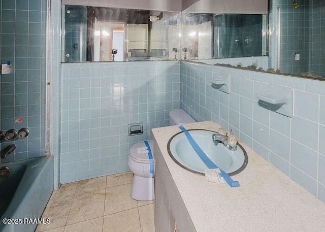 1010 Dugas Ln, Saint Martinville, LA 70582 - bathroom featuring tile walls, toilet, tile patterned floors, vanity, and shower / tub combination