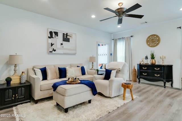 living area with a ceiling fan, recessed lighting, light wood-style floors, and visible vents