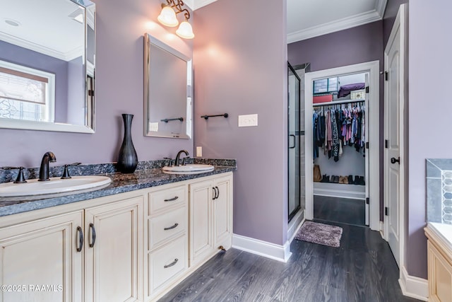 205 Lo Saab Cv, Lafayette, LA 70506 - full bathroom with ornamental molding, wood finished floors, a stall shower, baseboards, and double vanity