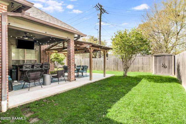 205 Lo Saab Cv, Lafayette, LA 70506 - view of yard featuring ceiling fan, a patio, and a storage shed