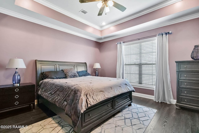 205 Lo Saab Cv, Lafayette, LA 70506 - bedroom with dark wood-style flooring, a raised ceiling, baseboards, crown molding, and a ceiling fan