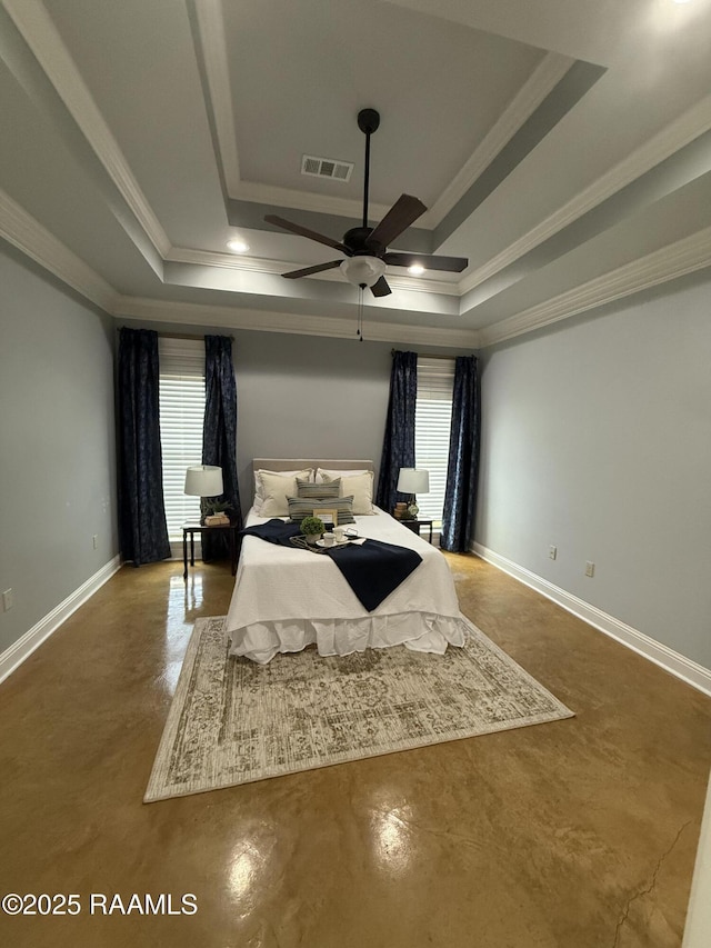 115 Hacienda Ln, Lafayette, LA 70508 - bedroom featuring a tray ceiling, crown molding, baseboards, and finished concrete floors