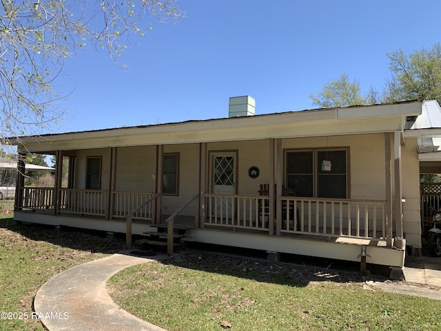 178 Wild Iris Dr, Evangeline, LA 70537 - view of front facade with covered porch and a chimney