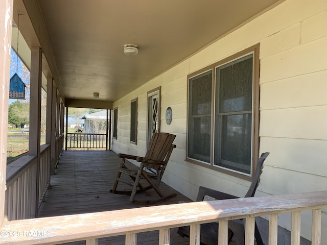 178 Wild Iris Dr, Evangeline, LA 70537 - wooden terrace featuring a porch