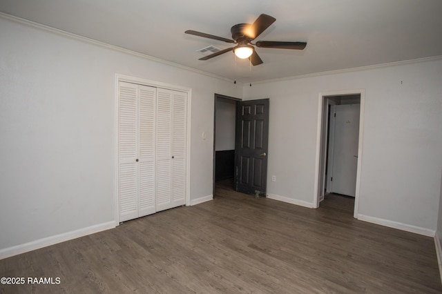 104 Raphael Dr, Lafayette, LA 70508 - unfurnished bedroom with crown molding, wood finished floors, a closet, and a ceiling fan