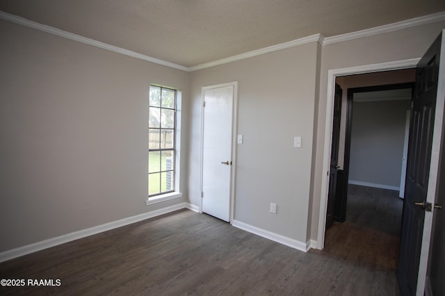 104 Raphael Dr, Lafayette, LA 70508 - spare room with dark wood finished floors, healthy amount of natural light, and crown molding