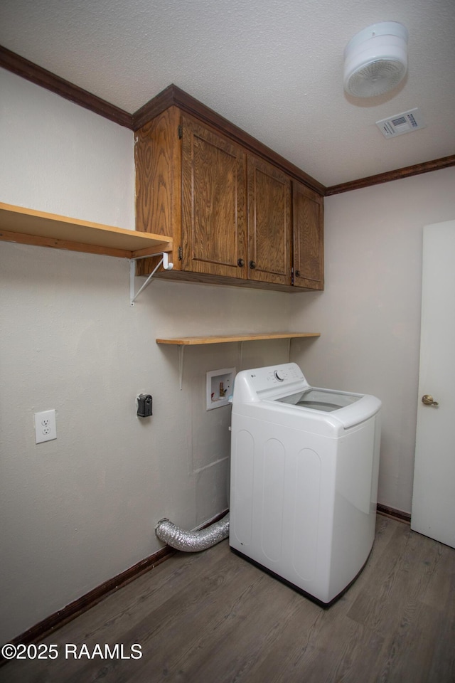 104 Raphael Dr, Lafayette, LA 70508 - laundry area with washer / dryer, light wood-type flooring, cabinet space, and crown molding