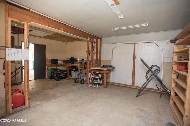 104 Raphael Dr, Lafayette, LA 70508 - basement featuring a workshop area and a garage