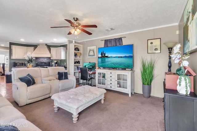 living room featuring light colored carpet, ceiling fan, visible vents, recessed lighting, and ornamental molding