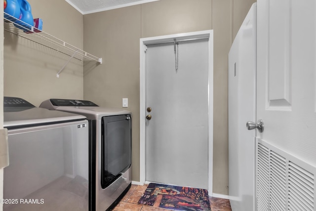 laundry room featuring separate washer and dryer, laundry area, and baseboards