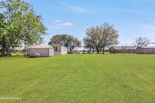 view of yard with an outbuilding and a storage unit