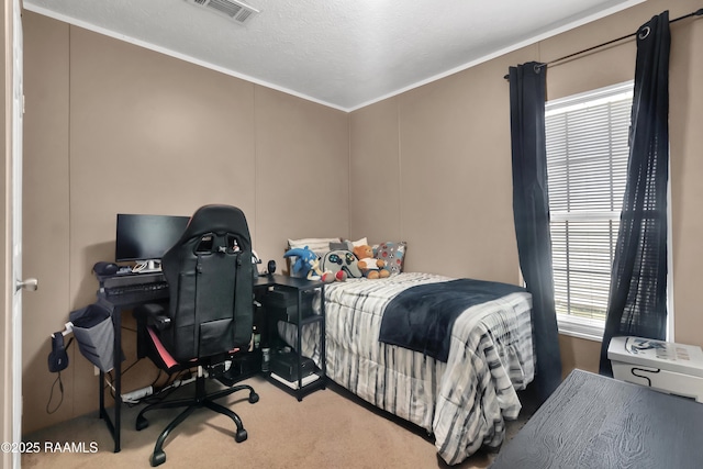 bedroom featuring visible vents, crown molding, and carpet floors