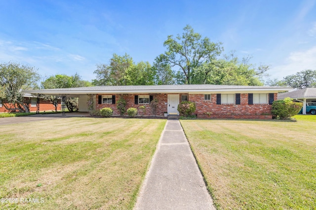 300 W Saint Louis St, Lafayette, LA 70506 - ranch-style home with a front yard, brick siding, and a carport