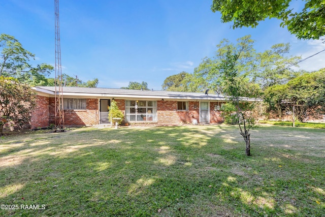 300 W Saint Louis St, Lafayette, LA 70506 - ranch-style house with a front yard and brick siding