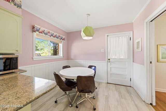 300 W Saint Louis St, Lafayette, LA 70506 - dining room featuring crown molding and a wainscoted wall