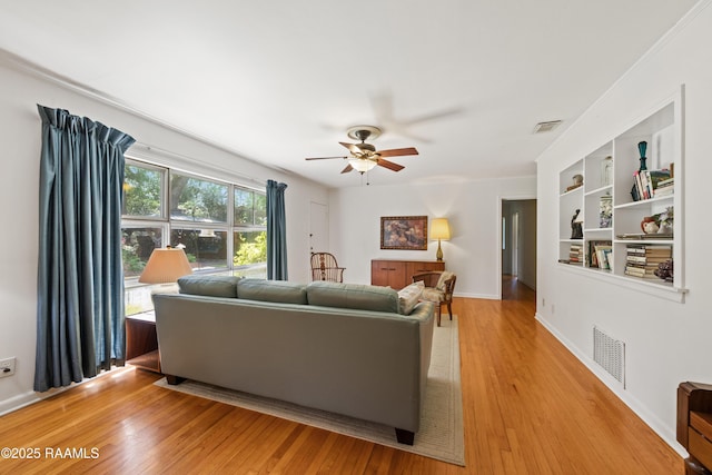 300 W Saint Louis St, Lafayette, LA 70506 - living room with light wood-type flooring, ceiling fan, and visible vents