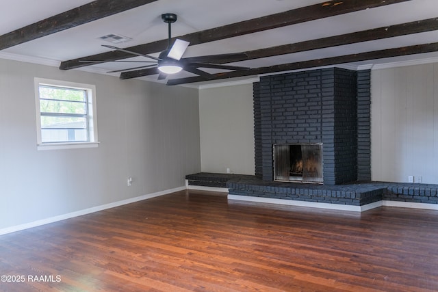 unfurnished living room featuring baseboards, beam ceiling, ceiling fan, and wood finished floors