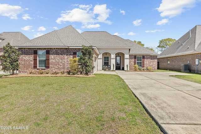 114 Marigold Ln, Maurice, LA 70555 - view of front facade with driveway, brick siding, a front lawn, and roof with shingles