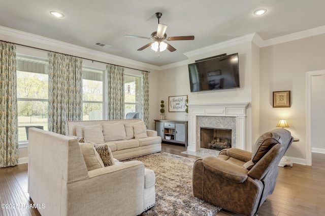 114 Marigold Ln, Maurice, LA 70555 - living area featuring hardwood / wood-style flooring, ceiling fan, ornamental molding, and plenty of natural light