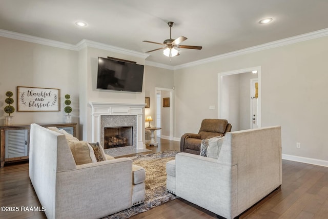 114 Marigold Ln, Maurice, LA 70555 - living area featuring a fireplace with flush hearth, baseboards, ceiling fan, wood finished floors, and ornamental molding