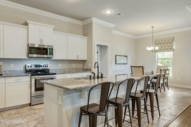 114 Marigold Ln, Maurice, LA 70555 - kitchen featuring visible vents, crown molding, a sink, and stainless steel appliances