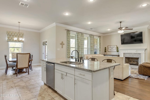114 Marigold Ln, Maurice, LA 70555 - kitchen featuring a fireplace, ornamental molding, a sink, and stainless steel dishwasher