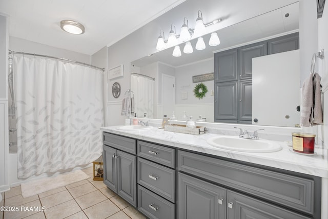 full bathroom featuring double vanity, tile patterned flooring, a sink, and shower / bathtub combination with curtain