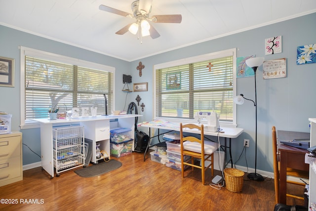 office area featuring wood finished floors, ornamental molding, and a ceiling fan