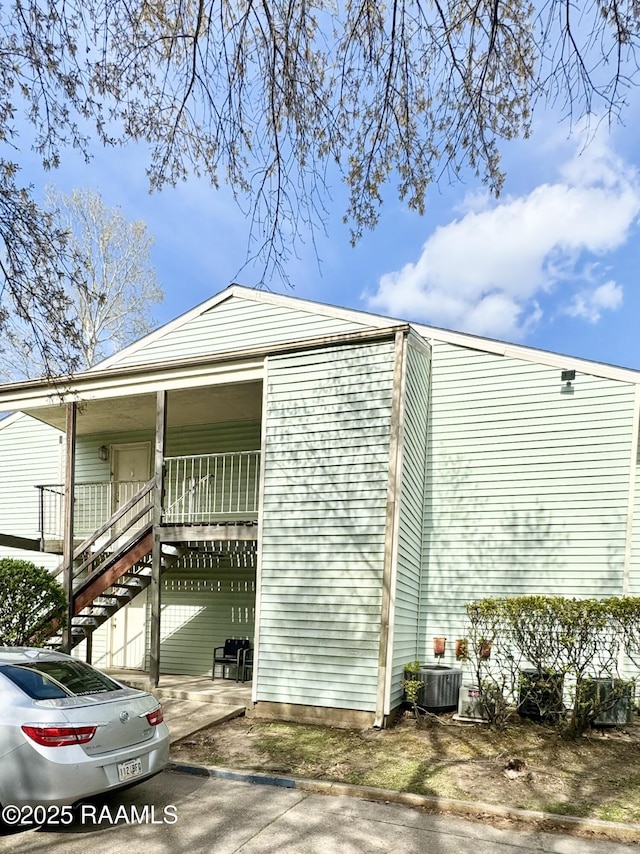 200 High Meadow Blvd Unit A-3A, Lafayette, LA 70507 - view of home's exterior featuring covered porch and stairway