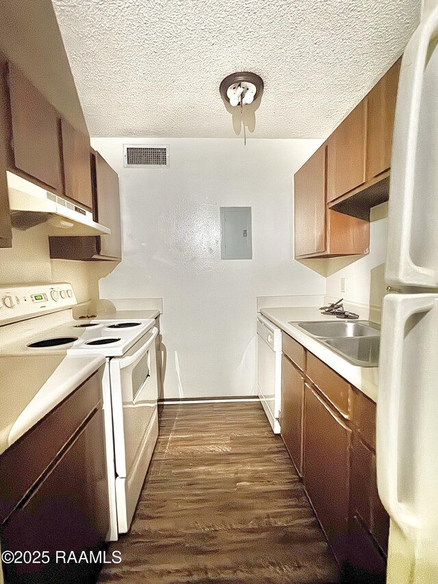 200 High Meadow Blvd Unit A-3A, Lafayette, LA 70507 - kitchen with white appliances, under cabinet range hood, a sink, dark wood-style floors, and visible vents