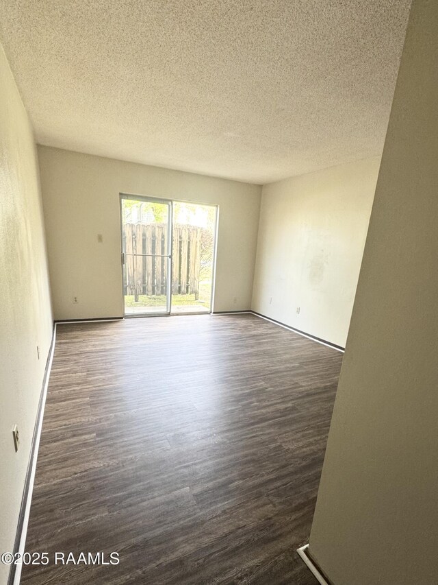 200 High Meadow Blvd Unit A-3A, Lafayette, LA 70507 - empty room featuring a textured ceiling and wood finished floors