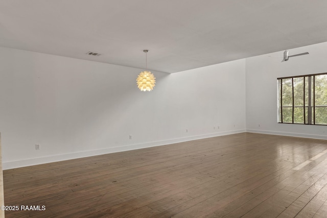 1201 S College Rd Unit 10, Lafayette, LA 70503 - spare room with baseboards, visible vents, and hardwood / wood-style floors