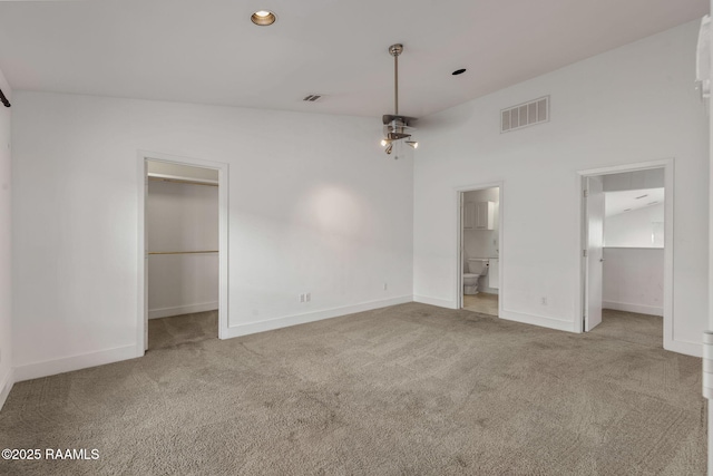 1201 S College Rd Unit 10, Lafayette, LA 70503 - unfurnished bedroom with carpet flooring, a walk in closet, and a closet