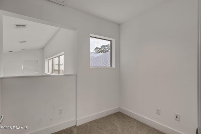 1201 S College Rd Unit 10, Lafayette, LA 70503 - carpeted empty room with baseboards and visible vents