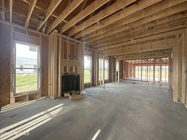 miscellaneous room with a fireplace and plenty of natural light