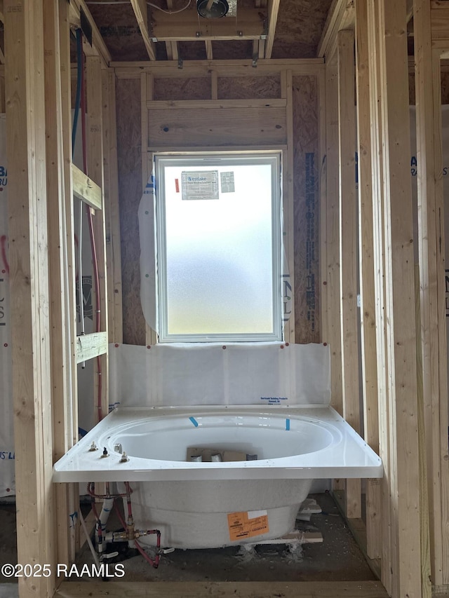 full bathroom with a tub to relax in