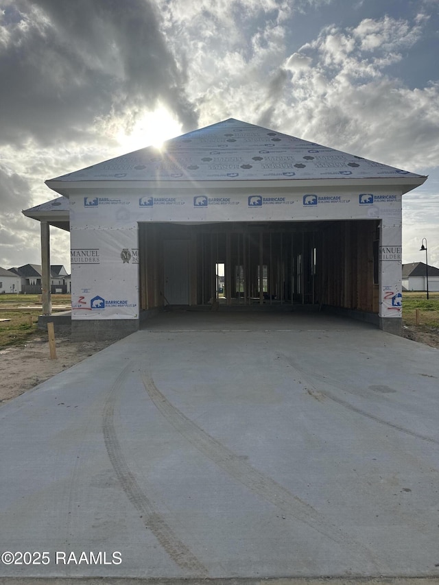 exterior space featuring a garage and concrete driveway