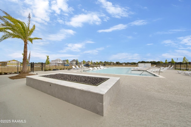 pool with fence and a patio