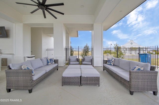 view of patio / terrace with fence, an outdoor living space, and ceiling fan