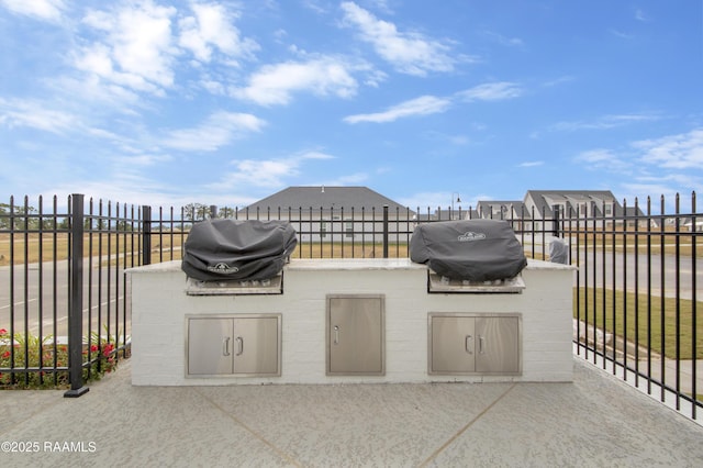 view of patio / terrace featuring grilling area, area for grilling, and fence