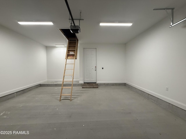 205 Keystone Dr, Scott, LA 70583 - garage featuring a garage door opener and baseboards